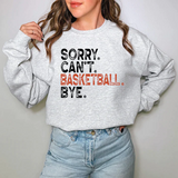 a woman wearing a sweatshirt that says sorry can't basketball bye