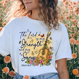 a woman standing in a field of flowers
