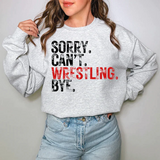 a woman wearing a sweatshirt that says sorry can't wrestling bye