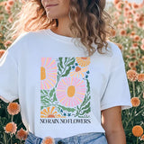 a woman standing in a field of flowers