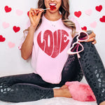a woman sitting on a bed brushing her teeth