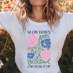 a woman standing in a field of flowers