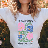 a woman standing in a field of flowers