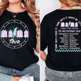 a woman wearing a black t - shirt with a tour schedule on it