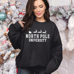 a woman wearing a black sweatshirt that says north pole university