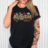 a woman wearing a black autism t - shirt