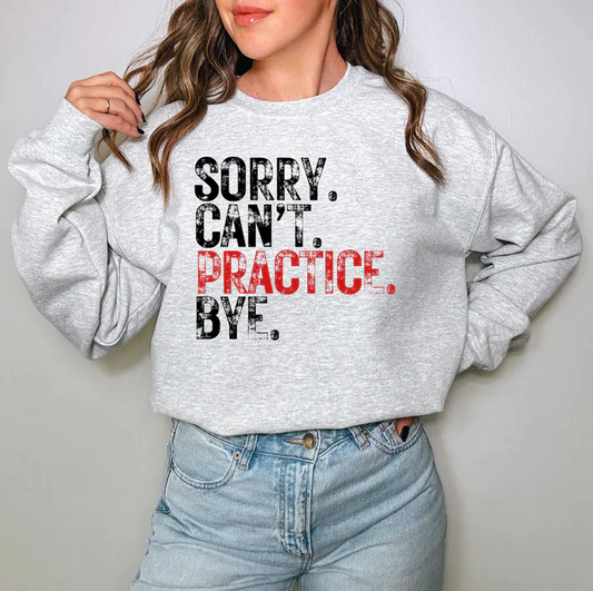 a woman wearing a sweatshirt that says sorry can't practice bye