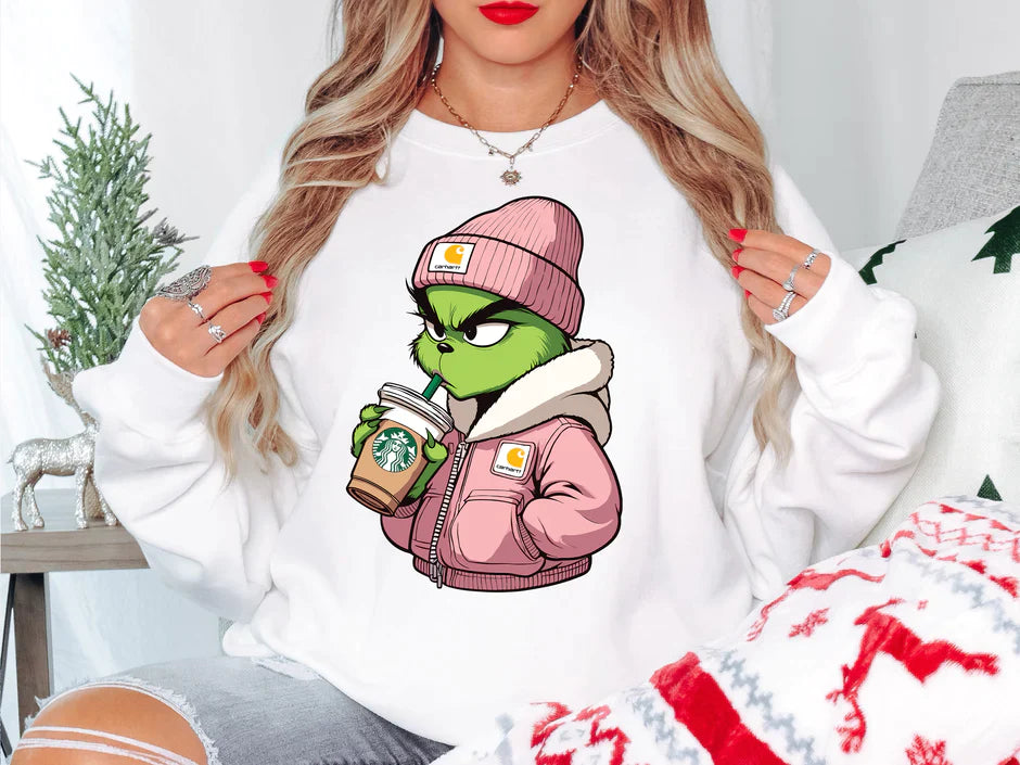 a woman wearing a white sweatshirt with a cartoon character on it