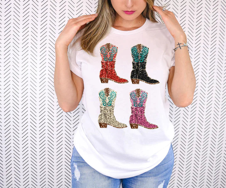 a woman wearing a white t - shirt with colorful boots on it