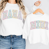 a woman wearing a white sweatshirt and jeans