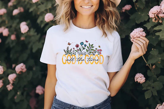 a woman wearing a white t - shirt with the words god in god on it