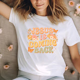 a woman wearing a jesus is coming back t - shirt