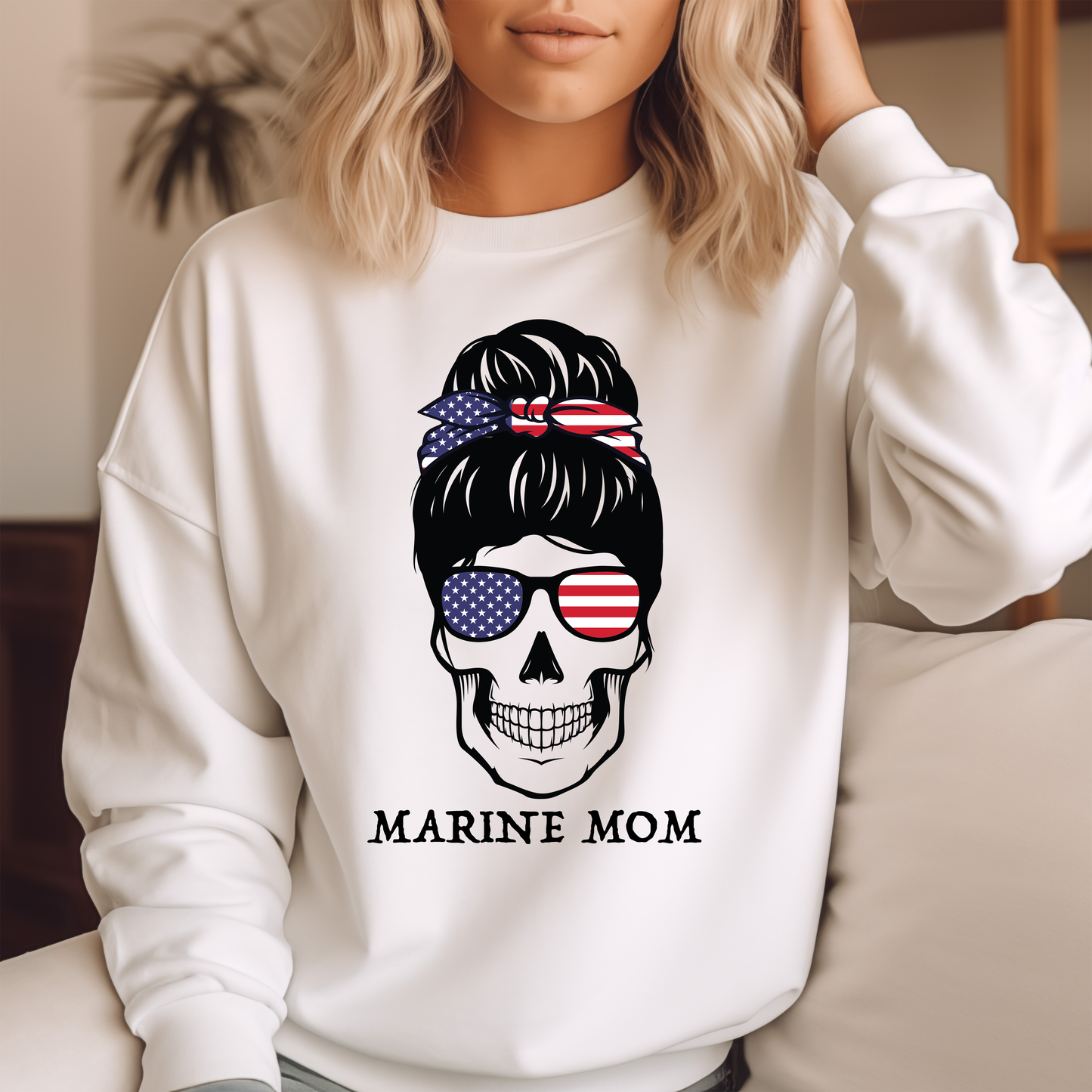 a woman wearing a sweatshirt with a skull wearing sunglasses
