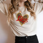 a woman wearing a sweater with a heart on it