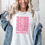 a woman wearing a t - shirt that says teaching is awesome