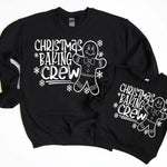 a couple of black sweatshirts sitting next to each other