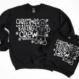 a couple of black sweatshirts sitting next to each other