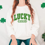 a woman wearing a lucky mama sweatshirt