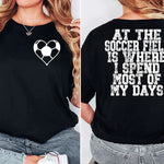 a woman wearing a black shirt with a heart on it