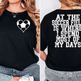 a woman wearing a black shirt with a heart on it
