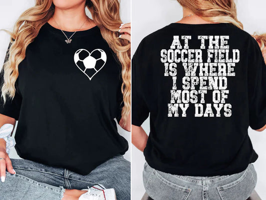 a woman wearing a black shirt with a heart on it