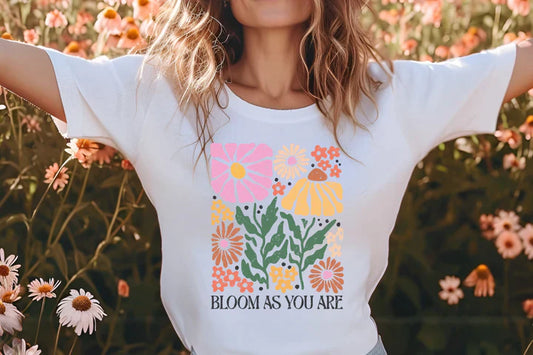 a woman standing in a field of flowers