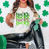 a woman sitting on a bed wearing a t - shirt that says lucky lucky