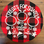 a red and black plate with a picture of a couple of rings on it