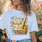 a woman standing in a field of flowers