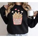 a woman is holding a cup of coffee