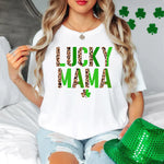 a woman sitting on a bed wearing a lucky mama shirt