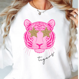 a woman with blonde hair wearing a white tiger t - shirt