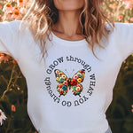 a woman standing in a field of flowers