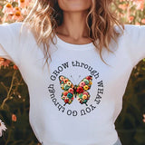 a woman standing in a field of flowers