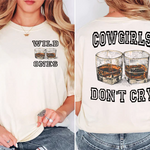 a woman wearing a cowgirl shirt with two glasses of whiskey on it
