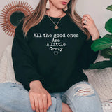 a woman wearing a black sweatshirt that says all the good ones are a little crazy