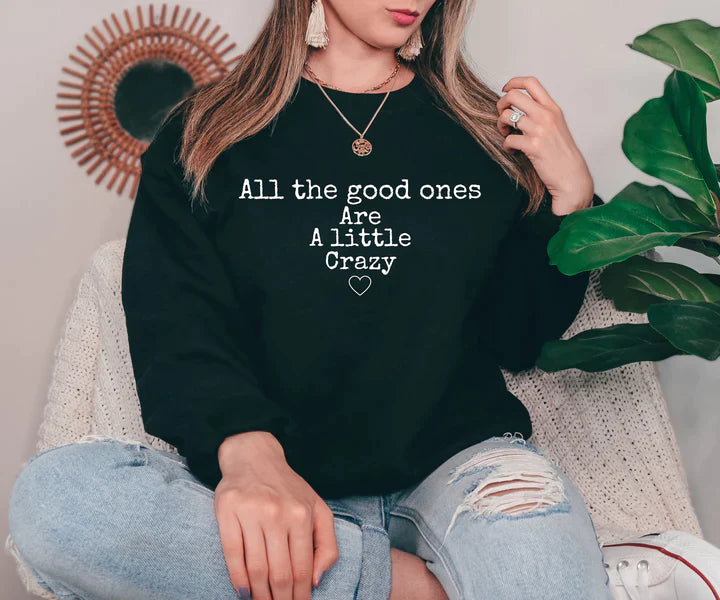 a woman wearing a black sweatshirt that says all the good ones are a little crazy