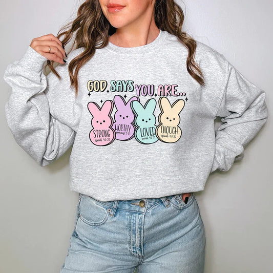 a woman wearing a sweatshirt that says god say you are