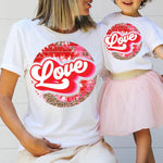a mother and daughter wearing love t - shirts