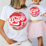 a mother and daughter wearing love t - shirts