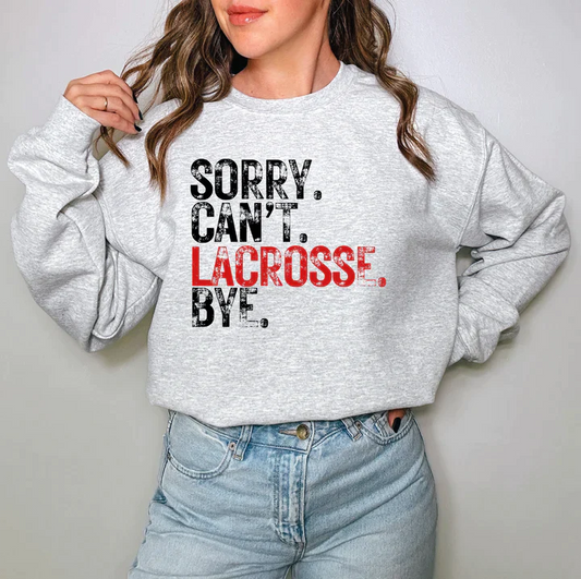 a woman wearing a sweatshirt that says sorry, can't i be lacrosse bye