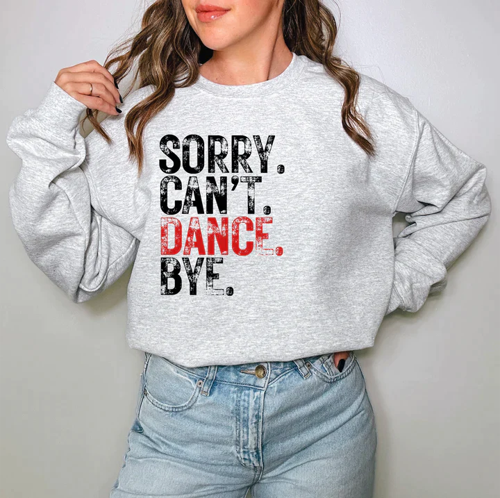 a woman wearing a sweatshirt that says sorry can't dance bye
