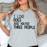 a woman wearing a t - shirt that says i like dogs and maybe three people