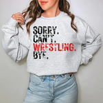 a woman wearing a sweatshirt that says sorry can't wrestling bye