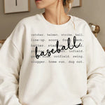 a woman wearing a sweatshirt that says baseball