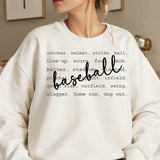 a woman wearing a sweatshirt that says baseball