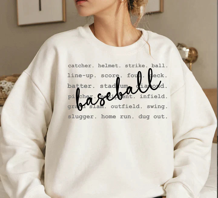 a woman wearing a sweatshirt that says baseball