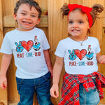 two young children standing next to each other