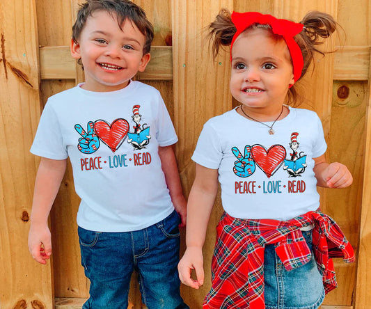 two young children standing next to each other