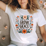 a woman laying on a bed of flowers wearing a t - shirt that says grow